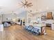 Open layout view of the kitchen and living room with vaulted ceilings, recessed lighting, and wood-style flooring at 4252 Quail Ranch Rd, New Smyrna Beach, FL 32168
