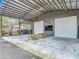 Spacious metal building with roll-up doors, picnic tables, and ample room for storage and recreational activities at 4252 Quail Ranch Rd, New Smyrna Beach, FL 32168