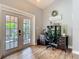 Home office featuring a desk, chair, and view to the outdoor patio area at 4252 Quail Ranch Rd, New Smyrna Beach, FL 32168
