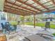 Inviting outdoor patio with comfortable seating and views of the spacious yard at 4252 Quail Ranch Rd, New Smyrna Beach, FL 32168