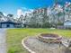 Lush acreage with multiple buildings, fire pit and picturesque treeline, perfect for outdoor living and relaxation at 4252 Quail Ranch Rd, New Smyrna Beach, FL 32168