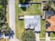 The property features a big yard, privacy fence, patio cover and a neighboring property with solar panels and screened-in pool at 509 Kettering Rd, Deltona, FL 32725