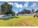 Large backyard with a patio set and ample green space for recreation at 509 Kettering Rd, Deltona, FL 32725