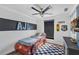 This bedroom features a themed car bed, ceiling fan, and wood-look floors at 509 Kettering Rd, Deltona, FL 32725
