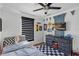 This bedroom features a themed car bed, ceiling fan, and wood-look floors at 509 Kettering Rd, Deltona, FL 32725
