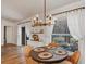 Cozy dining area with a modern chandelier and views of the outdoors at 509 Kettering Rd, Deltona, FL 32725