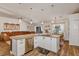Kitchen island with stainless steel appliances and an open layout to the living room at 509 Kettering Rd, Deltona, FL 32725