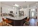 Modern kitchen with stainless steel appliances, granite countertops, and a large central island with seating at 509 Kettering Rd, Deltona, FL 32725