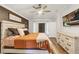 This main bedroom features a TV, wood-look floors, and neutral walls at 509 Kettering Rd, Deltona, FL 32725