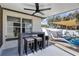 Enjoy this outdoor space with a ceiling fan, outdoor seating, and shade at 509 Kettering Rd, Deltona, FL 32725