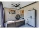 Relaxing covered patio with ceiling fan, outdoor seating, and entertainment area at 509 Kettering Rd, Deltona, FL 32725