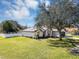 Charming single-story home with a manicured lawn and a white privacy fence at 509 Kettering Rd, Deltona, FL 32725