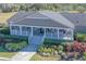 Charming single-story home with a spacious front porch and beautifully landscaped front yard at 5306 Empire Church Rd, Groveland, FL 34736