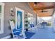 Relaxing front porch with rocking chairs and a hammock at 5306 Empire Church Rd, Groveland, FL 34736