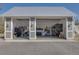 Spacious detached garage with ample storage, metal roof, and workshop area at 5306 Empire Church Rd, Groveland, FL 34736