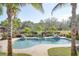 Backyard pool with water features and lush landscaping at 5306 Empire Church Rd, Groveland, FL 34736