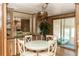 Bright dining area featuring a dining table with white chairs at 55634 Sam St, Astor, FL 32102