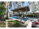 Waterfront dock with covered boat lift offers perfect boat parking space at 55634 Sam St, Astor, FL 32102