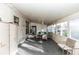 Enclosed sunroom with carpet, table set, and multiple windows providing plenty of natural light at 55634 Sam St, Astor, FL 32102