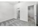 Bright bedroom features neutral walls, carpet, and a closet at 559 Coronado Cove Rd, New Smyrna Beach, FL 32168