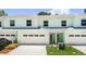 Inviting two-story townhome with attached garage and manicured landscaping at 559 Coronado Cove Rd, New Smyrna Beach, FL 32168