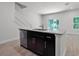 Kitchen island featuring granite countertop, stainless steel dishwasher and wood cabinets at 559 Coronado Cove Rd, New Smyrna Beach, FL 32168