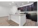 Modern kitchen featuring a center island, granite countertops and stainless steel appliances at 559 Coronado Cove Rd, New Smyrna Beach, FL 32168