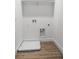 Laundry hookups in closet with wood-look tile flooring at 559 Coronado Cove Rd, New Smyrna Beach, FL 32168