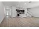 Spacious living room with luxury flooring, with open access to the kitchen and stair access at 559 Coronado Cove Rd, New Smyrna Beach, FL 32168