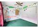 bedroom featuring creative wall decor and a ceiling fan at 599 S Cedar Ave, Orange City, FL 32763