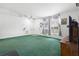 Bright living room with large window and ceiling fan at 599 S Cedar Ave, Orange City, FL 32763
