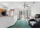 Living area with sliding glass doors to the outside and a small seating area at 599 S Cedar Ave, Orange City, FL 32763