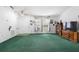 Bright living room featuring vaulted ceilings, an entry door, and an open floor plan at 599 S Cedar Ave, Orange City, FL 32763