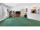 Spacious living room features vaulted ceilings, a kitchen view, and an open floor plan at 599 S Cedar Ave, Orange City, FL 32763