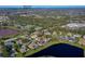 Aerial shot of the property and surrounding community near Cypress Creek Elementary School and a scenic lake at 6071 Sabal Hammock Cir, Port Orange, FL 32128