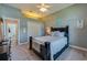 Bedroom featuring neutral tones, a ceiling fan, closet and gray walls at 6071 Sabal Hammock Cir, Port Orange, FL 32128