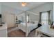 Bedroom featuring a four poster bed, neutral tones, a ceiling fan, and closet at 6071 Sabal Hammock Cir, Port Orange, FL 32128