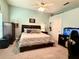 Bedroom featuring neutral tones, a ceiling fan, and an aquarium at 6071 Sabal Hammock Cir, Port Orange, FL 32128