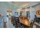 Spacious dining room with a large wooden table and views to other rooms at 6071 Sabal Hammock Cir, Port Orange, FL 32128