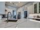 Bright kitchen with white cabinets, quartz countertops, stainless steel appliances and an open layout at 6071 Sabal Hammock Cir, Port Orange, FL 32128