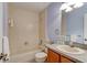 Bathroom features tub and shower combo, single sink vanity, and nautical decor at 6152 Sequoia Dr, Port Orange, FL 32127