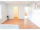 Bright bedroom featuring wood floors with walk-in closet and bathroom access at 6152 Sequoia Dr, Port Orange, FL 32127