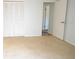 Spacious bedroom with carpet flooring, closet, and access to a bathroom with an open door at 6152 Sequoia Dr, Port Orange, FL 32127