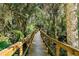 Community boardwalk winding through a lush, natural preserve offers residents a peaceful escape into nature at 6152 Sequoia Dr, Port Orange, FL 32127