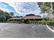 Community clubhouse with ample parking and a well-maintained exterior, offering a hub for activities and events at 6152 Sequoia Dr, Port Orange, FL 32127