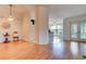 Bright living room showcasing an open floor plan, ceiling fan, and sliding glass doors leading to outdoor space at 6152 Sequoia Dr, Port Orange, FL 32127