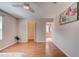 Bright main bedroom offers wood flooring, a walk-in closet, and ensuite bathroom, creating a comfortable private space at 6152 Sequoia Dr, Port Orange, FL 32127