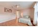Cozy main bedroom with a ceiling fan, laminate floors, and a serene ambiance at 6152 Sequoia Dr, Port Orange, FL 32127