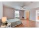 Spacious main bedroom with wood floors, a window for natural light, and a closet for storage at 6152 Sequoia Dr, Port Orange, FL 32127
