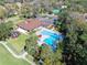 Aerial view of the community pool, clubhouse, playground, and parking area at 6157 Sequoia Dr, Port Orange, FL 32127